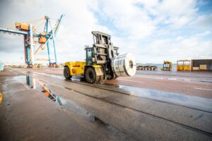 Logistics BusinessTough Hyster trucks for metal coil handling