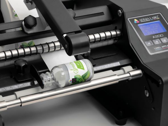 Logistics BusinessBottle label applicator added to AM range