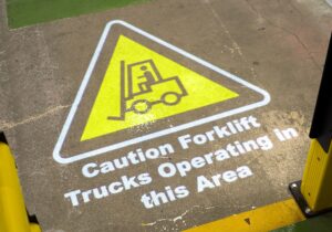 Logistics BusinessAutomated Projected Signage Makes Workplace Safer